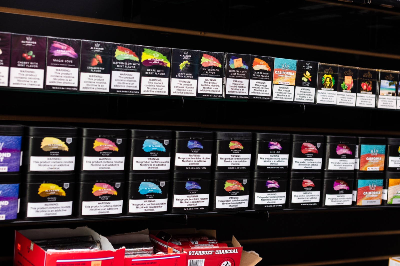 Al Fakher shisha tobacco and charcoal merchandising wall